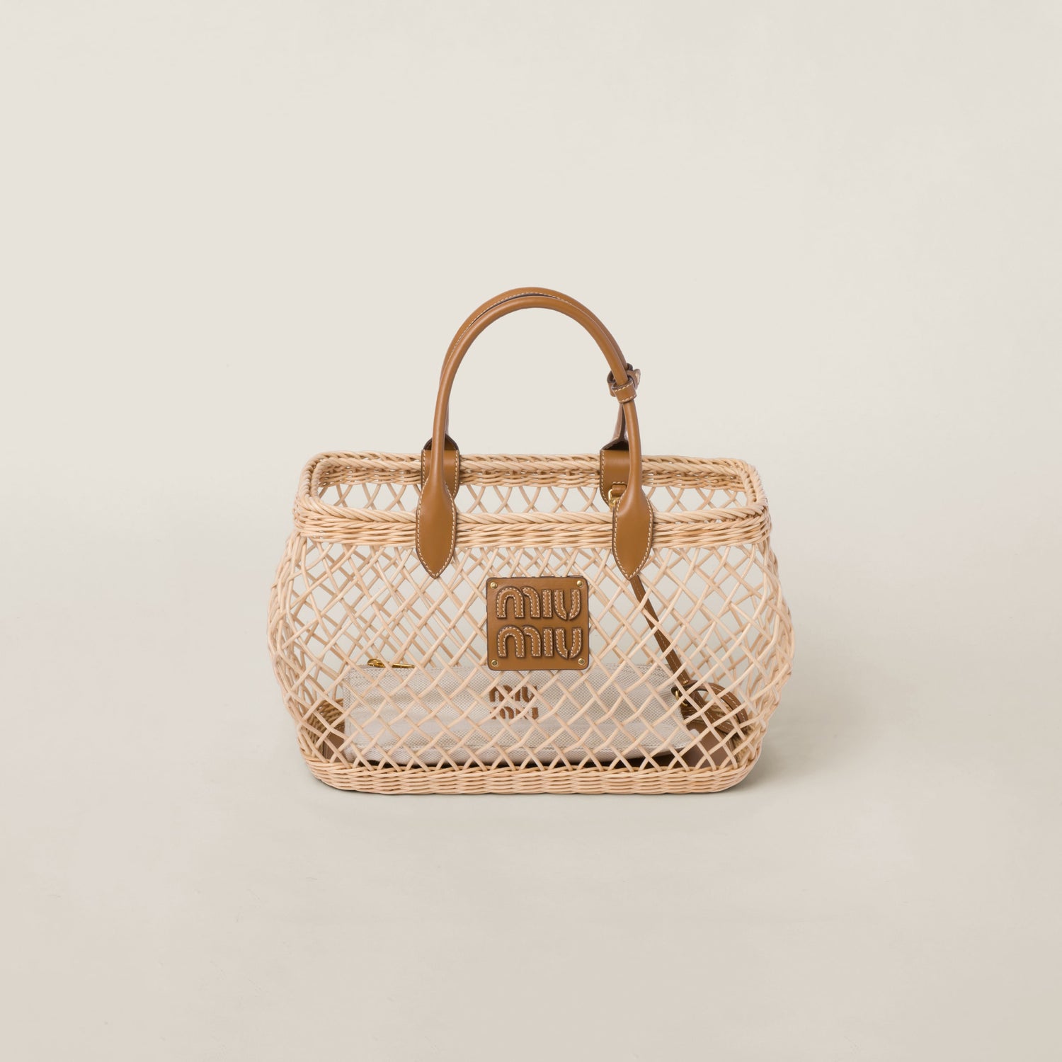 Woven fabric handbag with leather trim