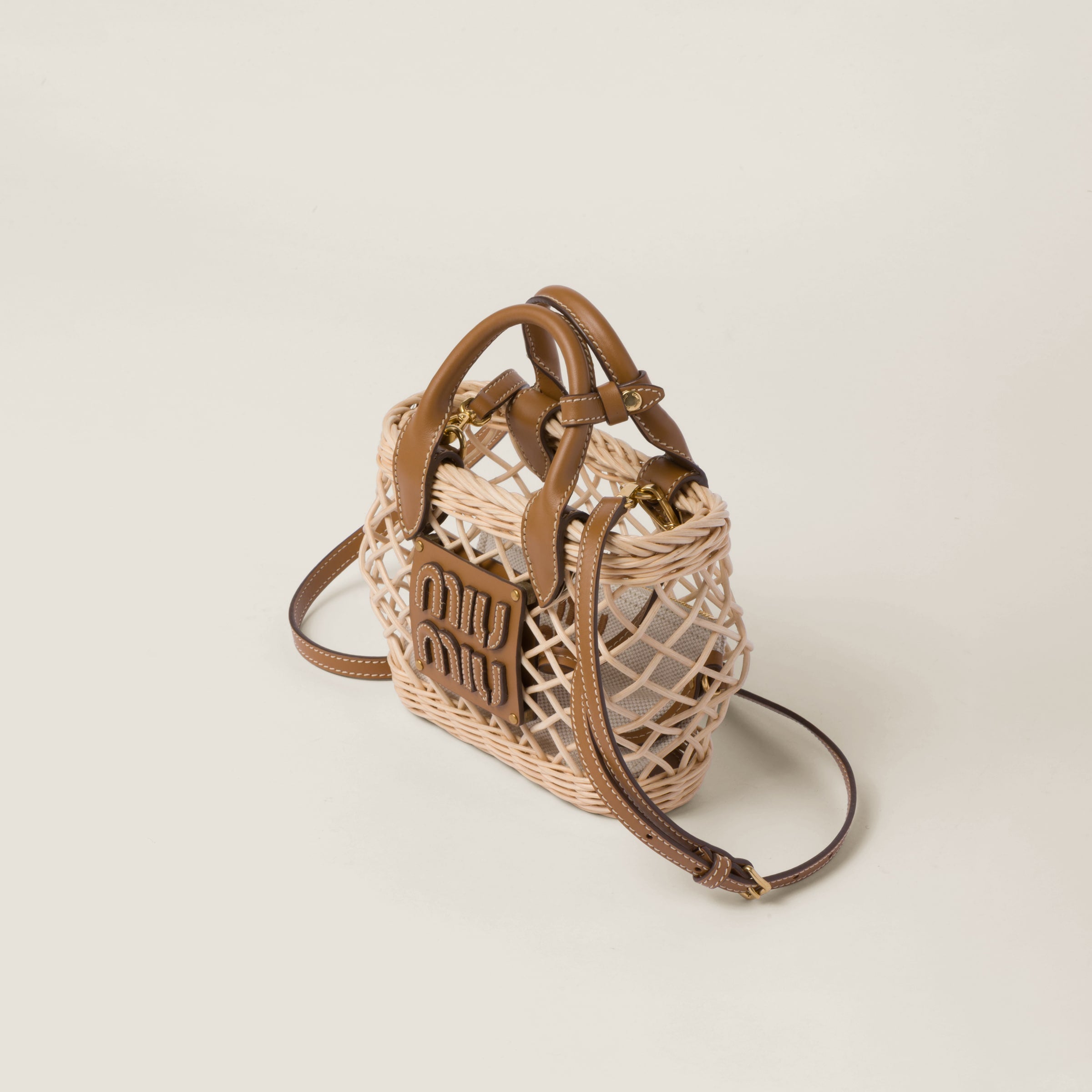 Woven fabric handbag with leather trim