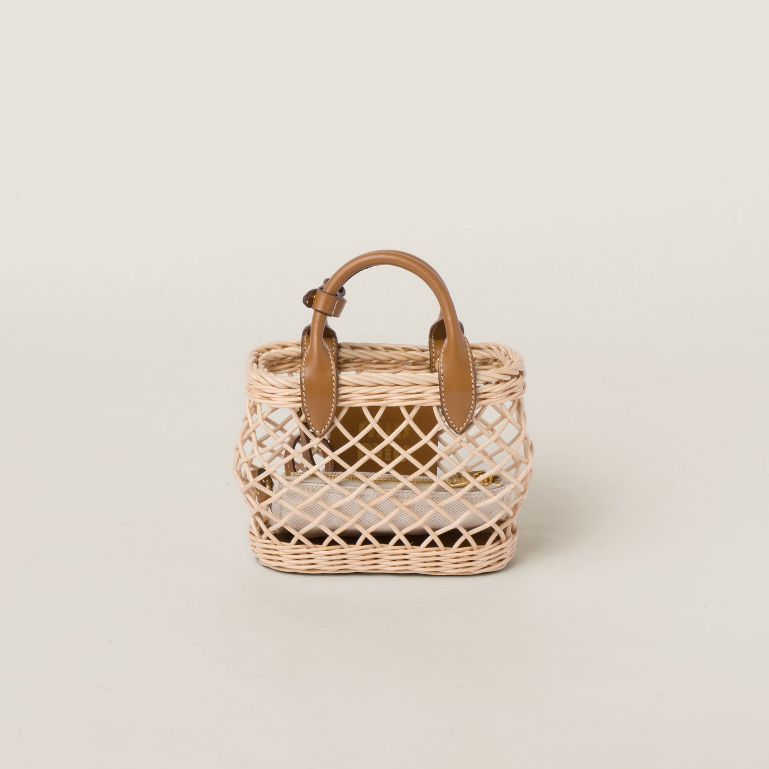 Woven fabric handbag with leather trim