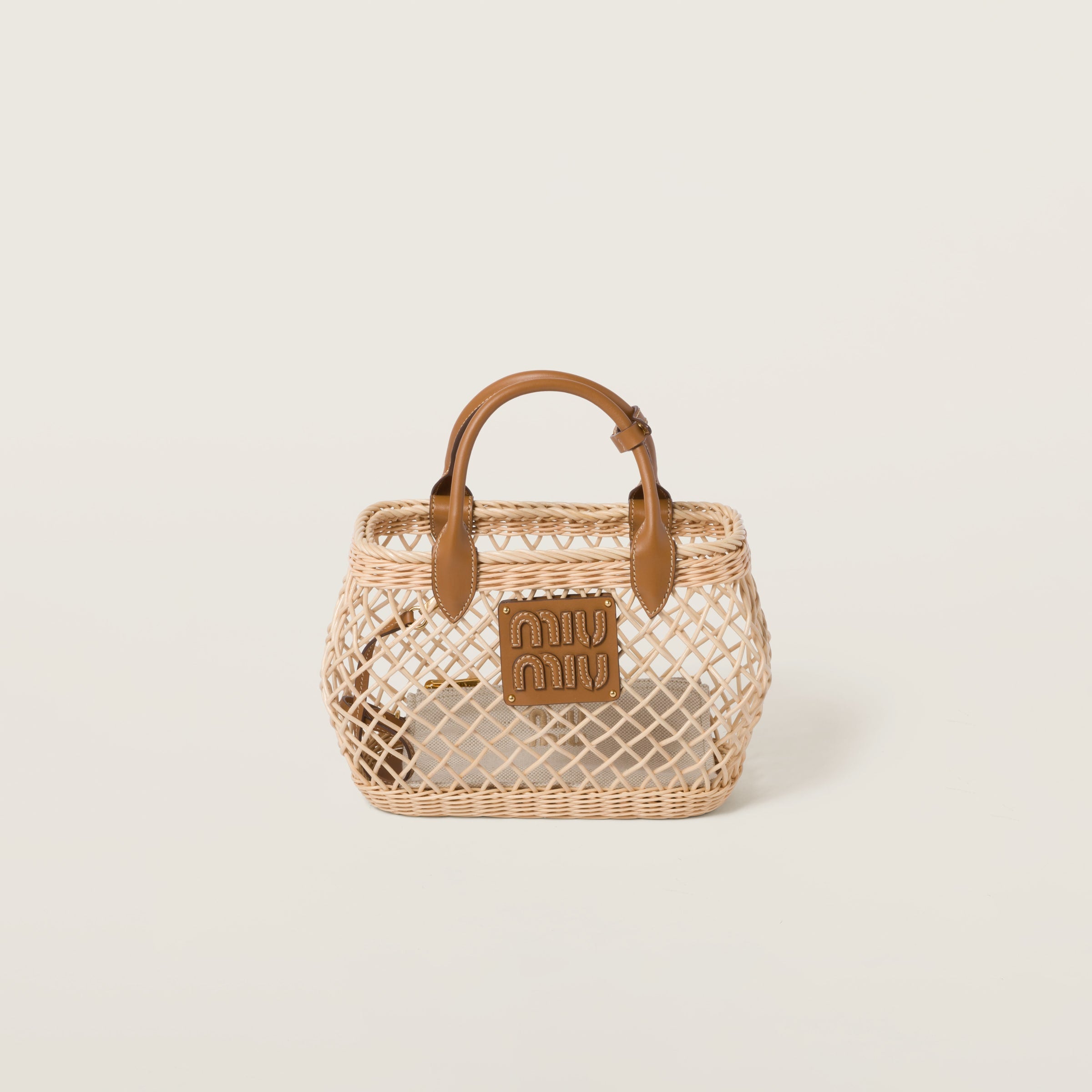 Woven fabric handbag with leather trim