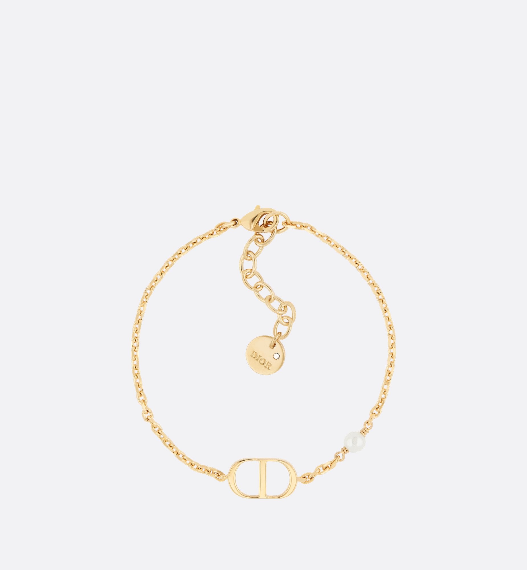 Petit Cd Bracelet Gold Finish Metal With A White Resin Pearl