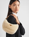 Prada Arqué shearling and leather shoulder bag