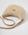 Arqué shearling and leather shoulder bag