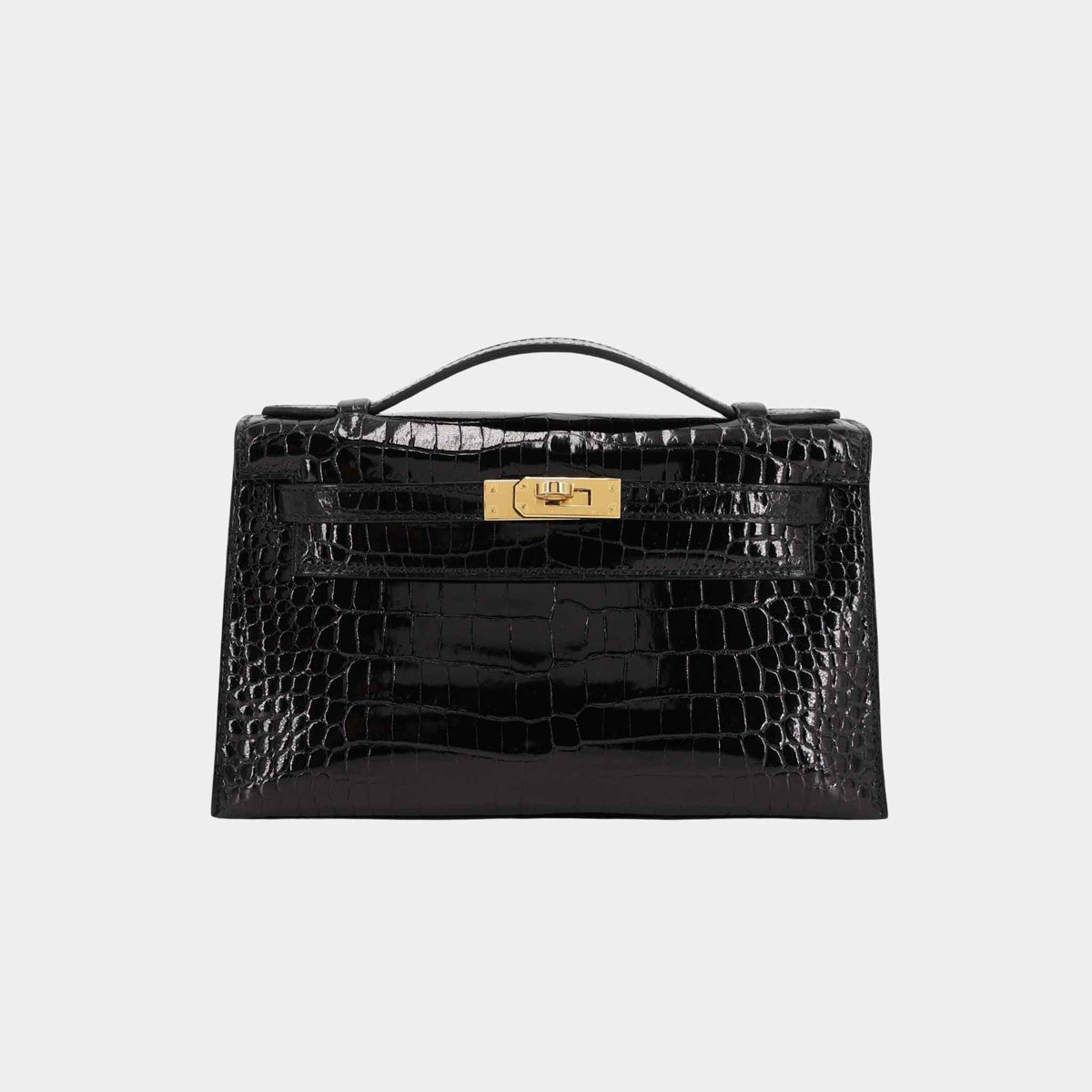 حقيبة Kelly Pochette من تمساح Porosus أسود مع حليات ذهبية