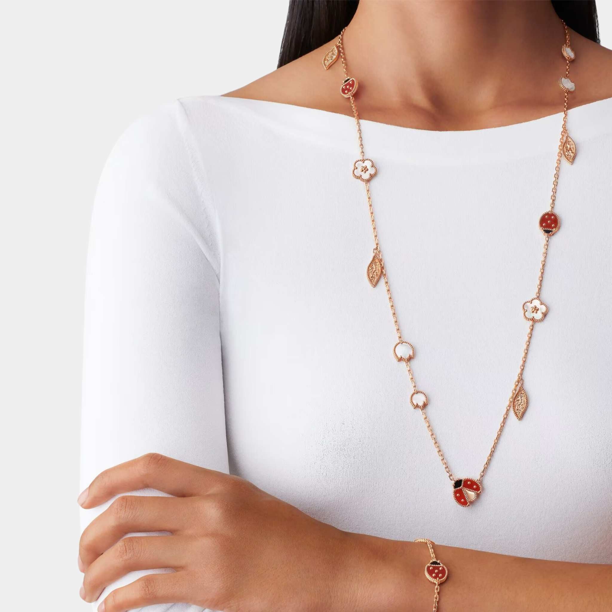 Lucky Spring Long Necklace 15 motifs Rose Gold Carnelian Pearl Onyx, Model